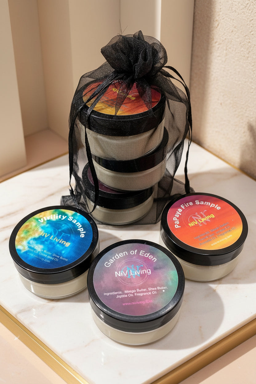 A trio of lotion samples in black jars with colorful labels, presented with a black ribbon bow on top.